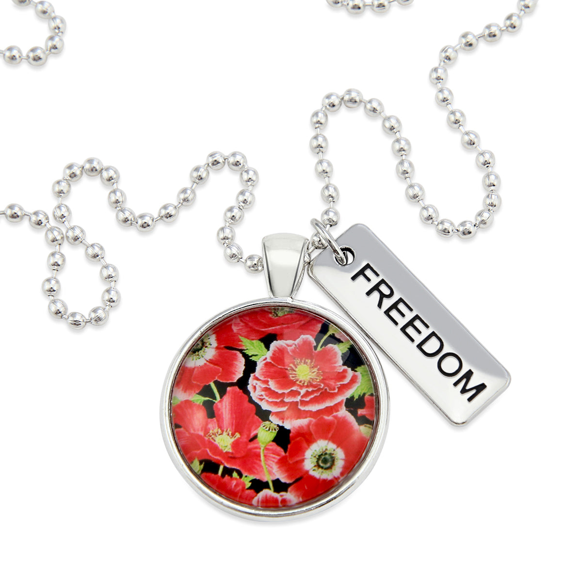 Necklace with floral pendant and 'FREEDOM' tag on a white background
