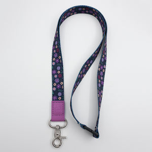 You Got This embossed on a navy floral lanyard with purple trim and a lobster clasp.