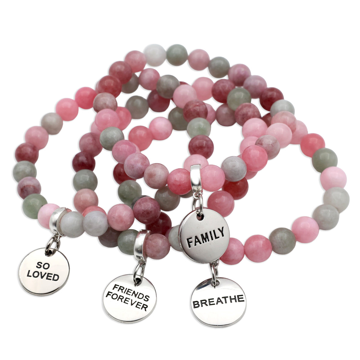 Pink and gray beaded bracelets with engraved charms on a white background