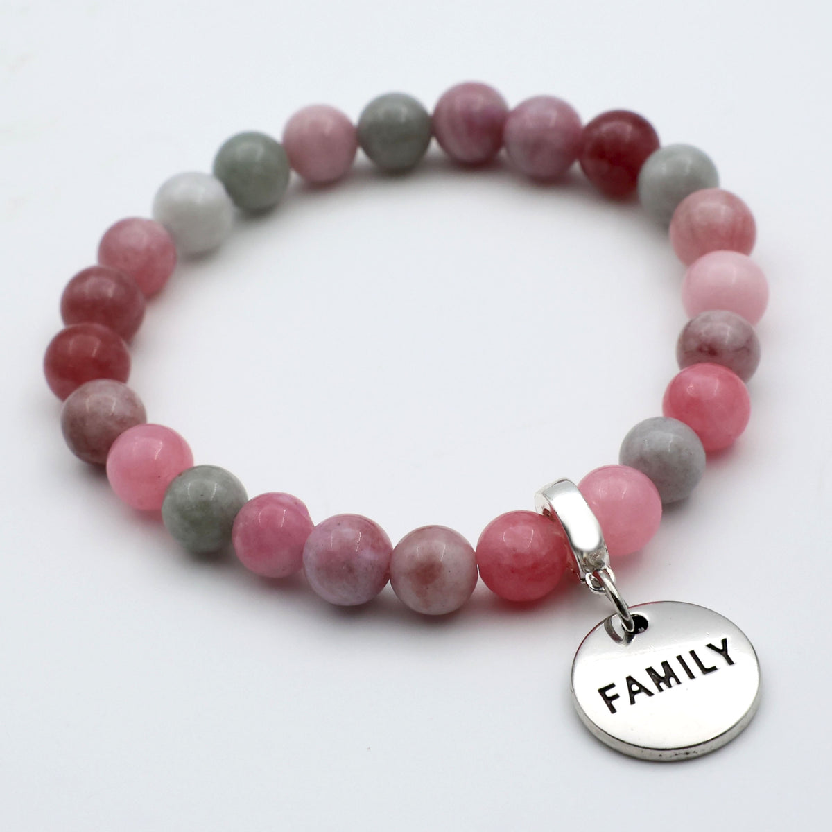 Beaded bracelet with a 'FAMILY' charm on a white background