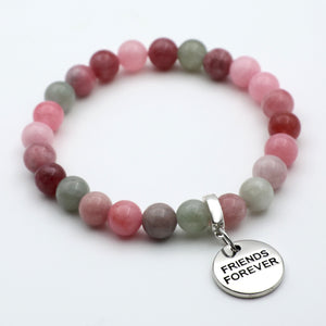Multicolored beaded bracelet with a 'Friends Forever' charm on a white background