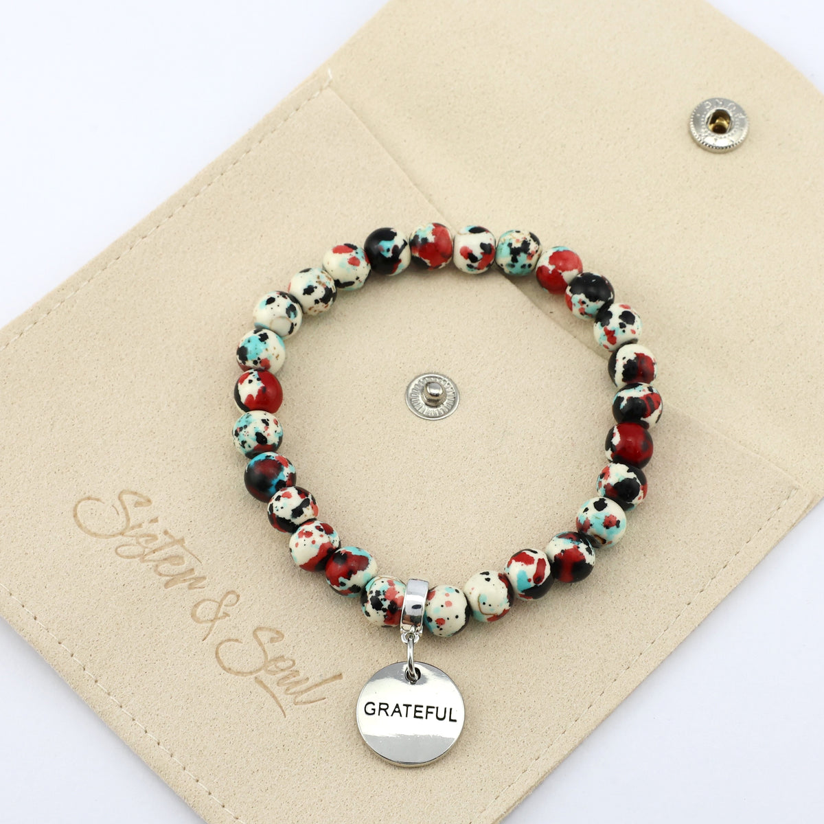 Stone Bracelet - Rebel Splash Speckled Howlite 8mm Beads - With Silver Word charm