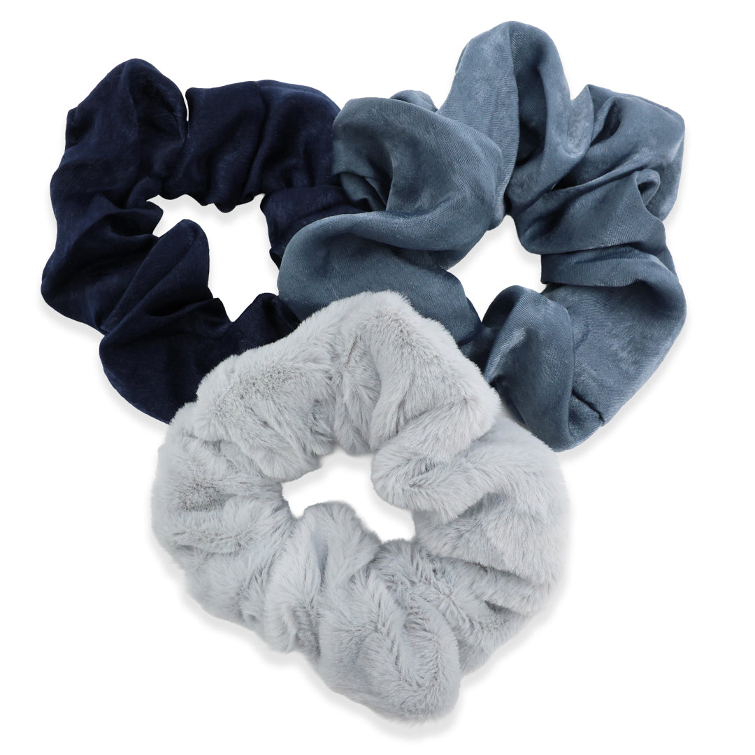 Three scrunchies in navy, blue, and gray on a white background