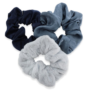 Three scrunchies in navy, blue, and gray on a white background