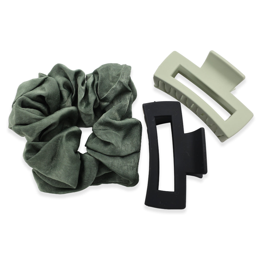Green scrunchie with two hair clips on a white background