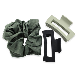 Green scrunchie with two hair clips on a white background