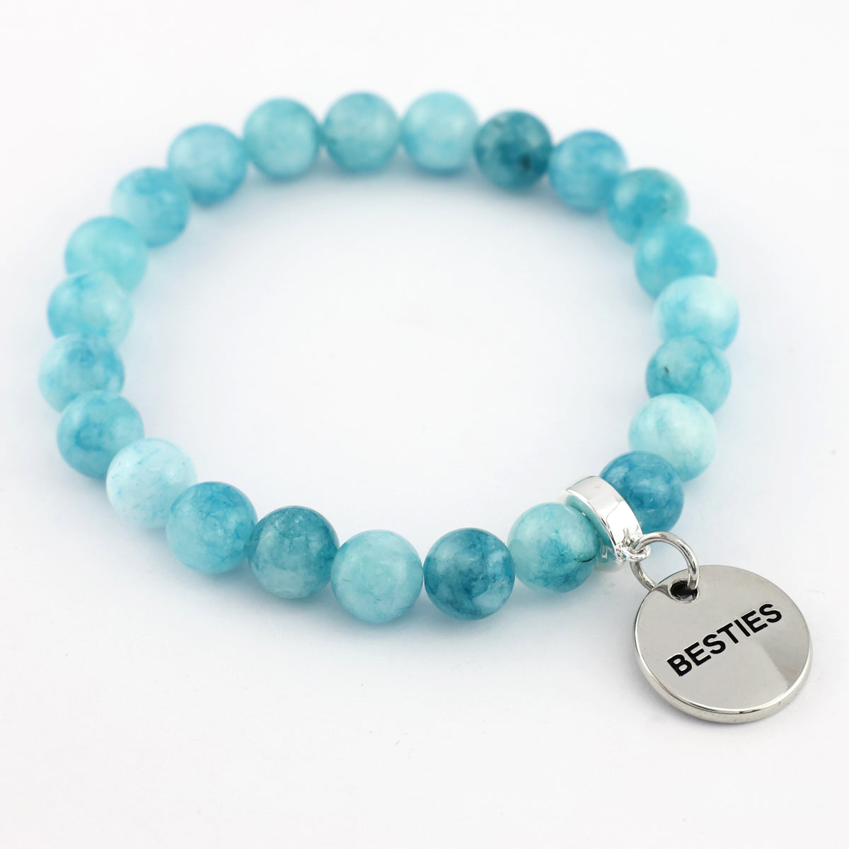 Turquoise beaded bracelet with a 'BESTIES' charm on a white background