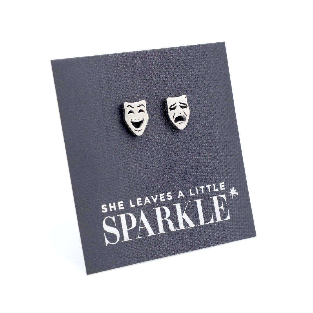 Pair of earrings on a card with 'She leaves a little sparkle' text