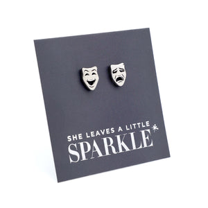 Pair of earrings on a card with 'She leaves a little sparkle' text