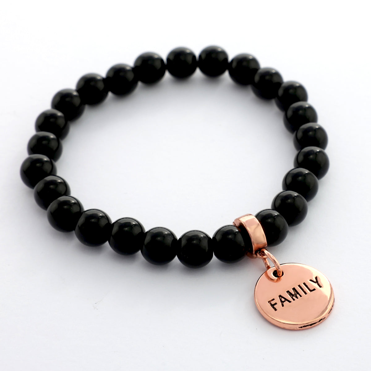 Black beaded bracelet with a rose gold 'FAMILY' charm on a white background