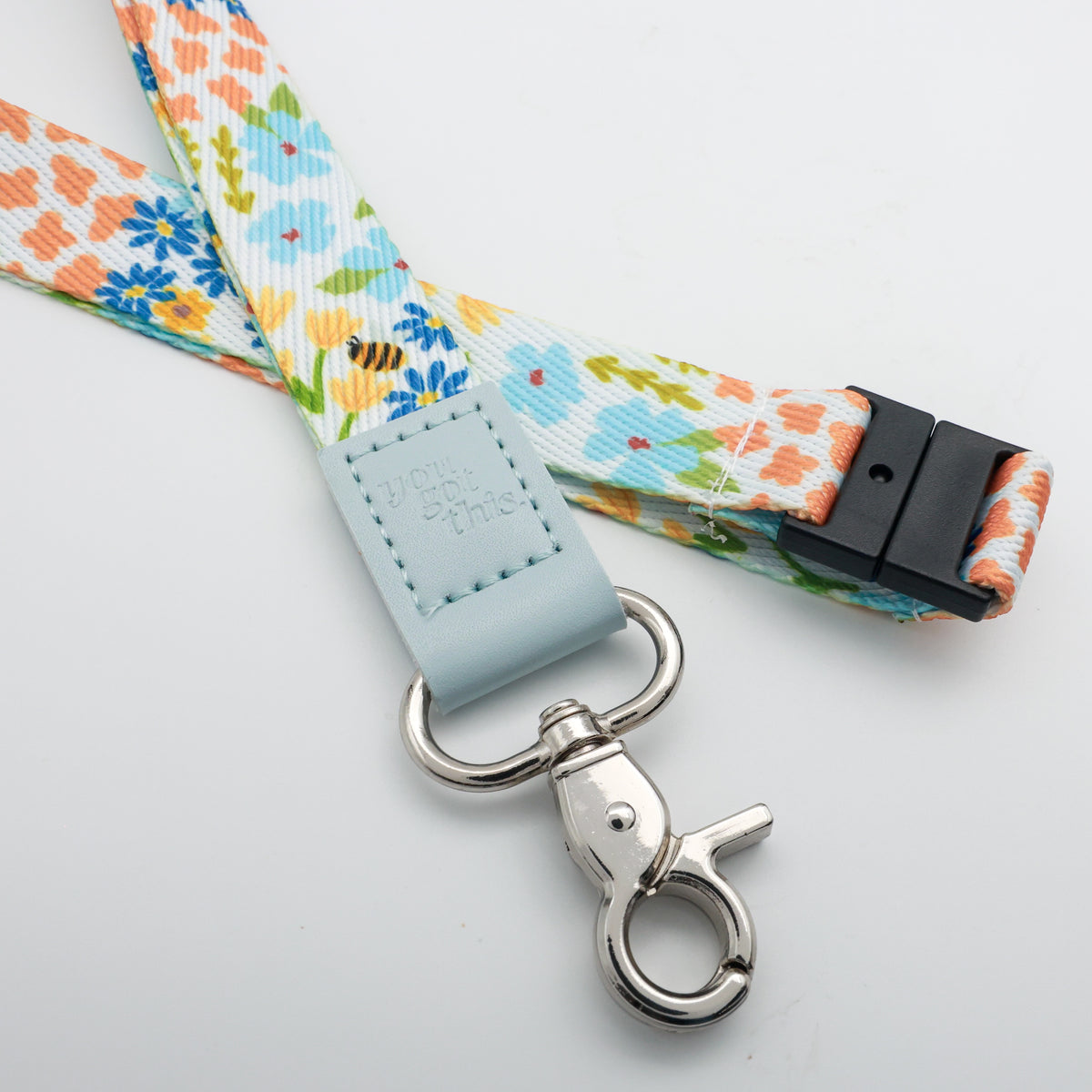 You Got This embossed on a colourful floral lanyard with pale blue trim and a lobster clasp.