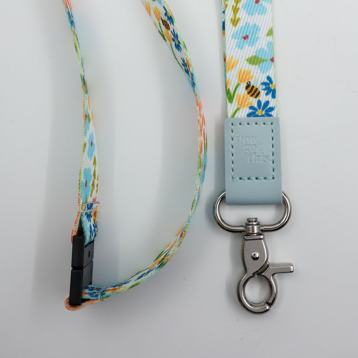 You Got This embossed on a colourful floral lanyard with pale blue trim and a lobster clasp.