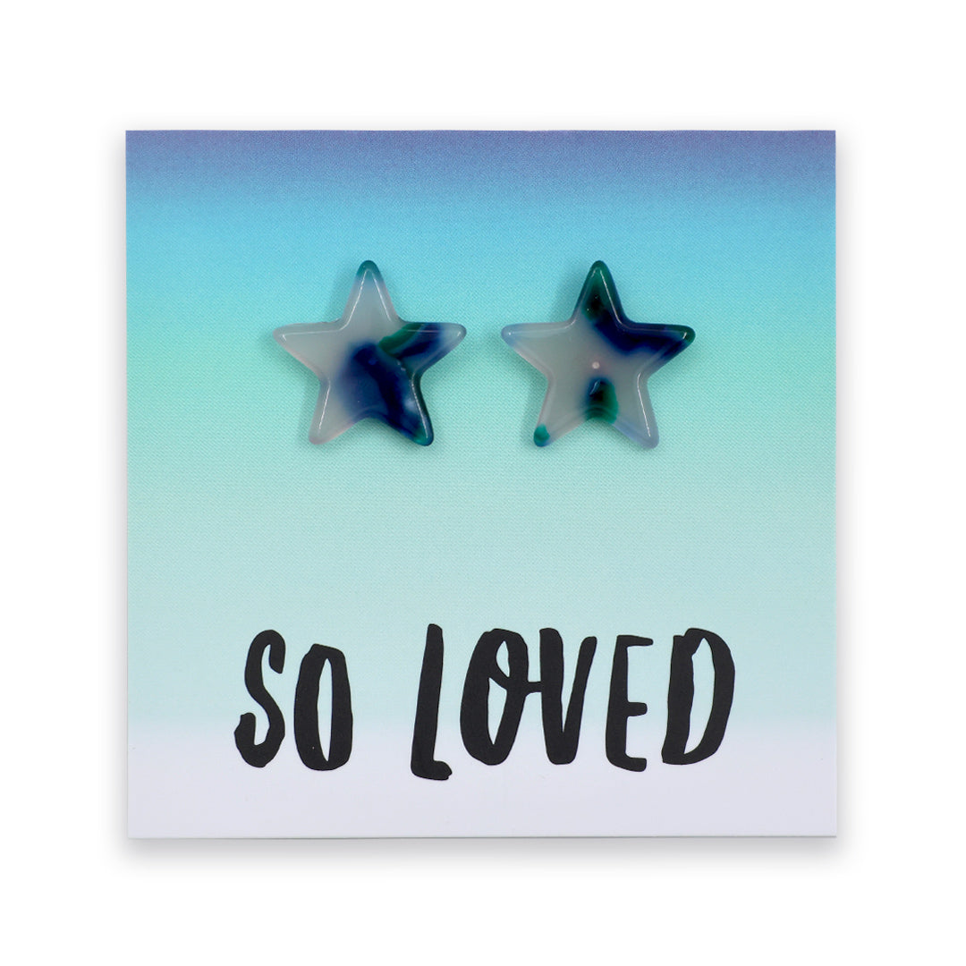 Two star-shaped stud earrings with a marbled blue, green, and white resin finish, displayed on a square card with the text 'SO LOVED' against a white background.