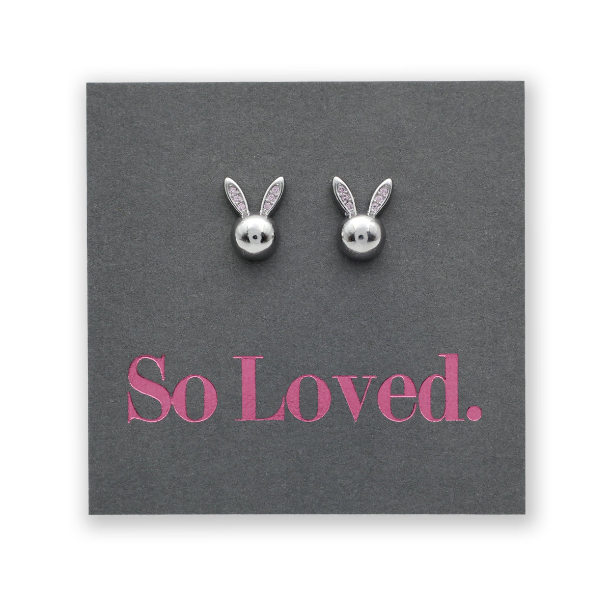 Sterling silver stud earrings in the shape of a rabbit face with pink CZ detailing, presented on a grey card with the text 'So Loved' in pink.