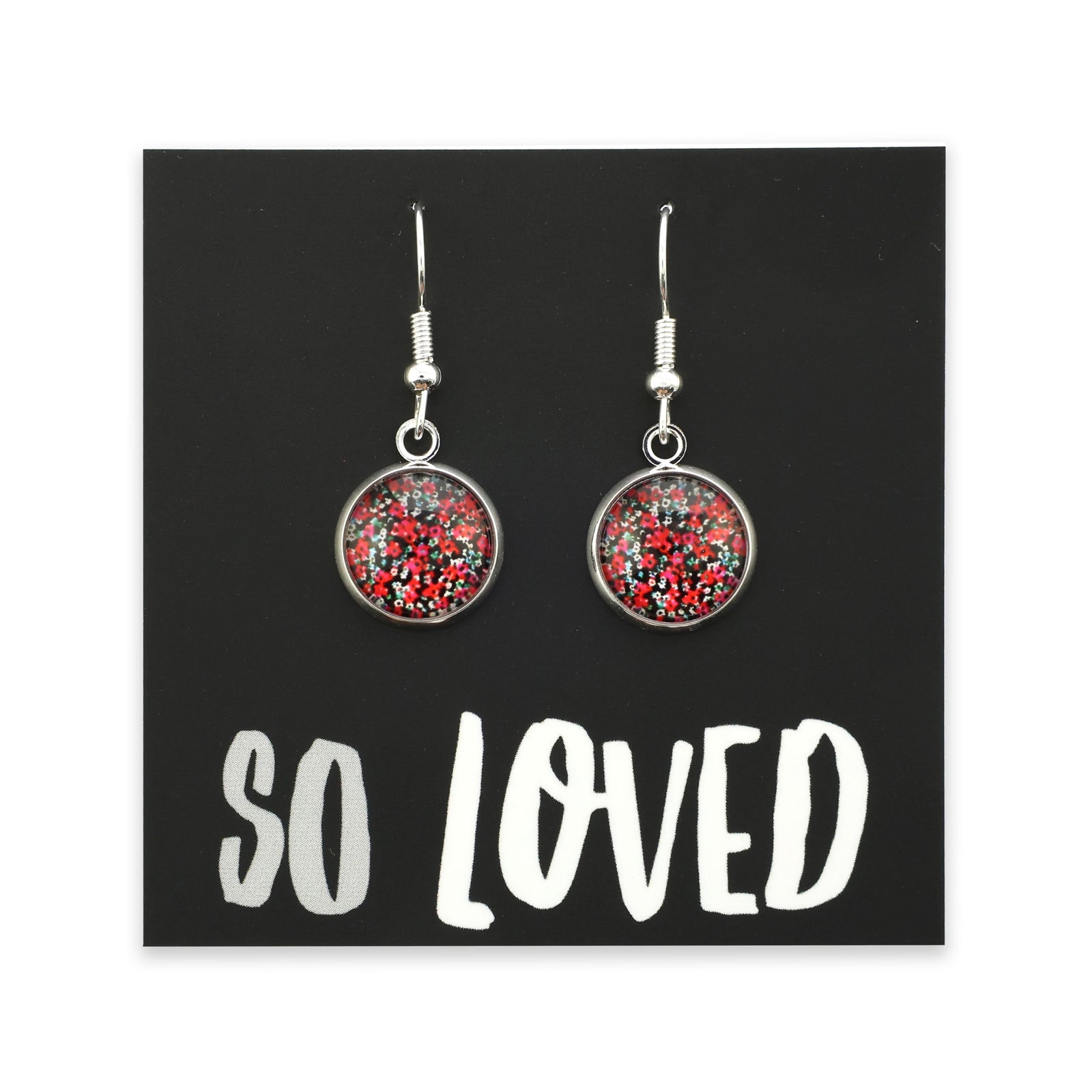 Pair of earrings with red and silver design on a 'SO LOVED' card