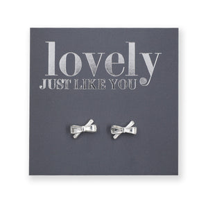 silver bows on a grey card that says "lovely just like you" on a white background 