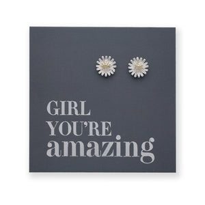 silver daisy studs on a grey card that says "girl You're Amazing" on a white background 