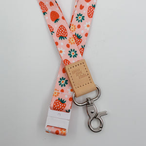 You Got This embossed on a pink strawberry and flower lanyard with tan trim and a lobster clasp.