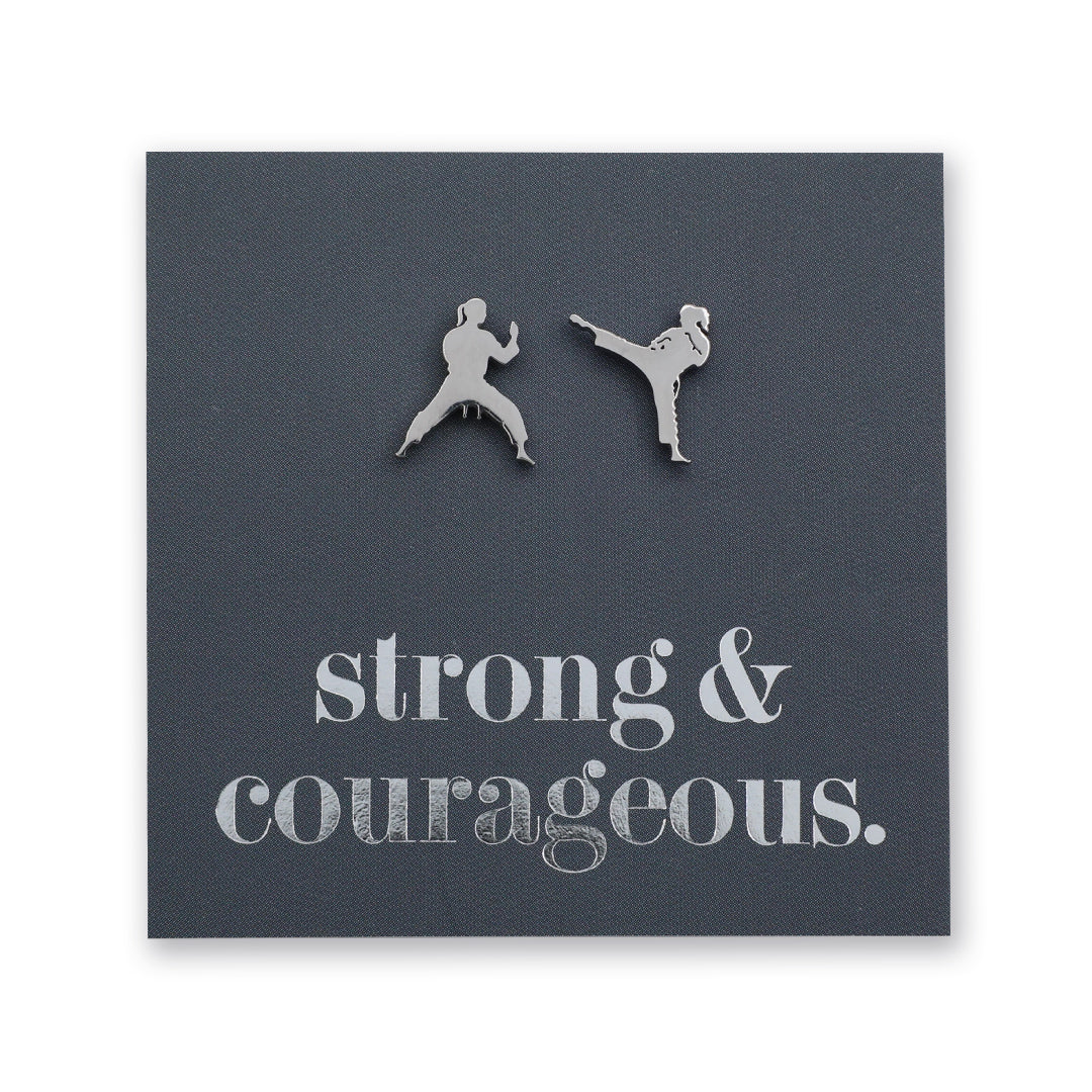 Silver Martial Art Studs on a grey card that says "strong & courageous" in silver writing, on a white background. 