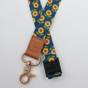 You Got This embossed on a navy sunflower lanyard with brown trim and a lobster clasp.