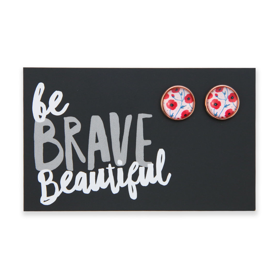Pair of floral earrings on a black card with 'be BRAVE Beautiful' text