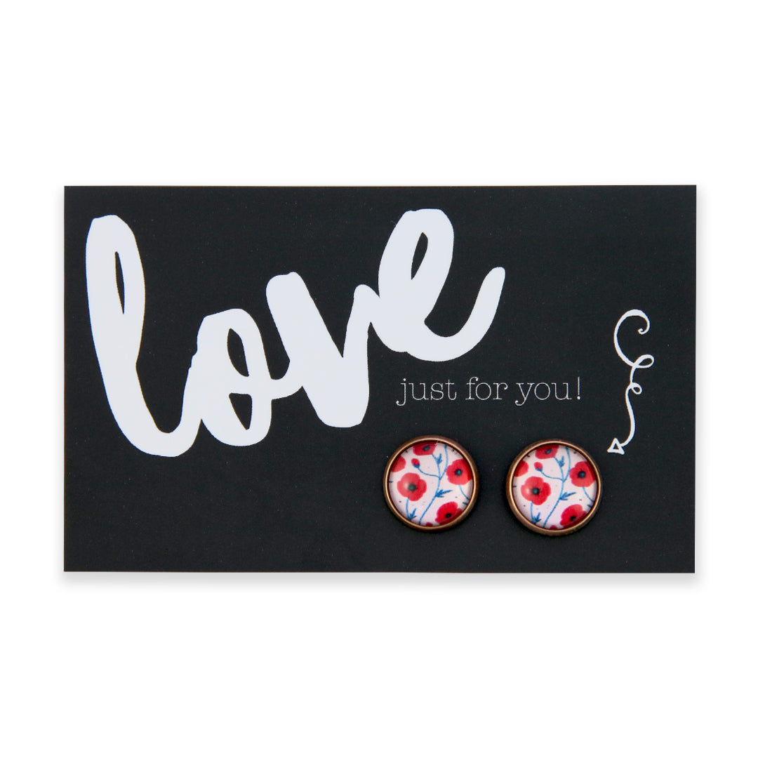 Pair of earrings with floral design on a card with 'love just for you!' text