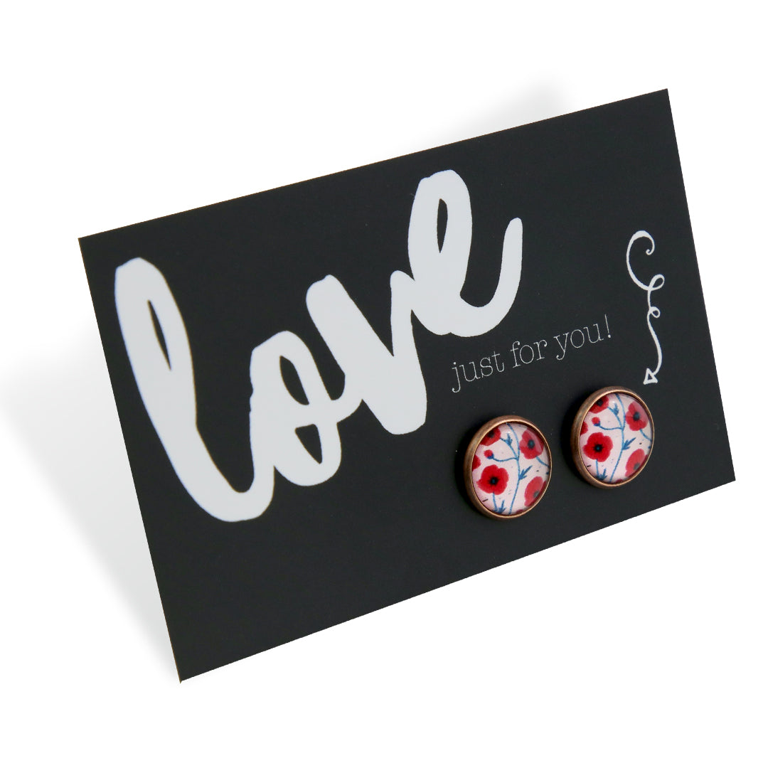Pair of earrings with floral design on a card with 'love just for you!' text