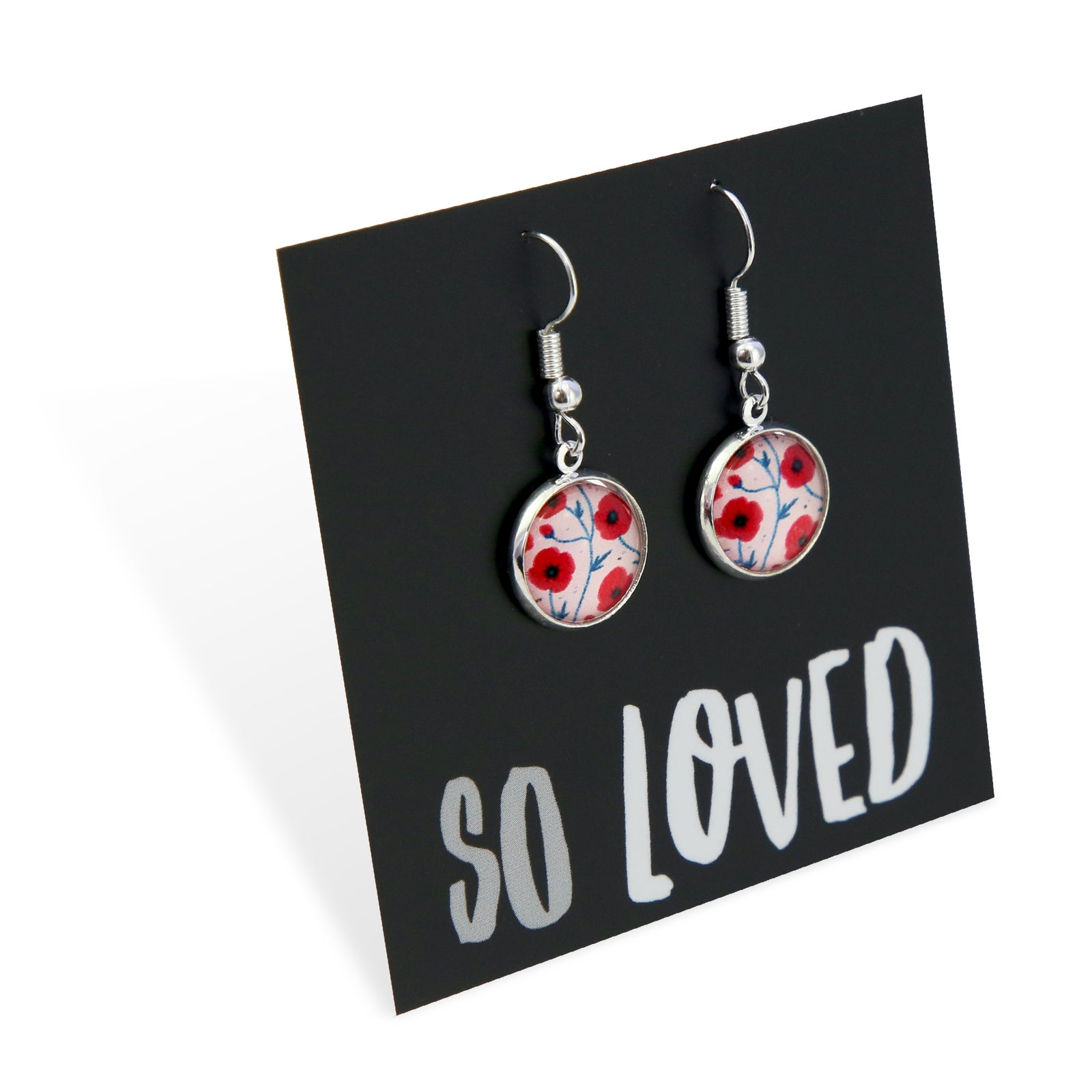 Pair of earrings with floral design on a black card with 'SO LOVED' text