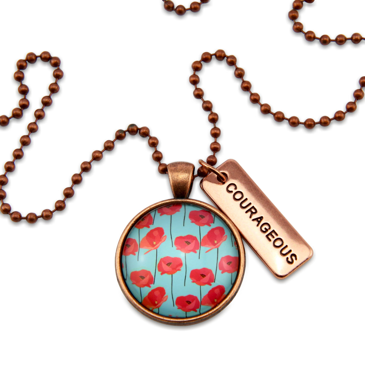 Necklace with floral pendant and 'COURAGEOUS' tag on a white background