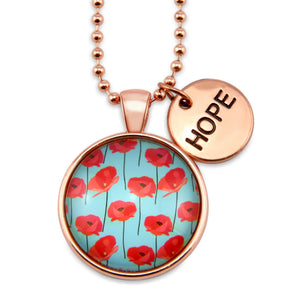 Necklace with red floral pendant and 'HOPE' tag on white background