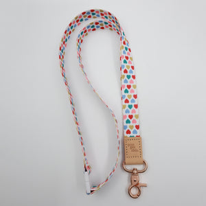 You Got This embossed on a white lanyard with multicoloured hearts and tan trim and a lobster clasp.