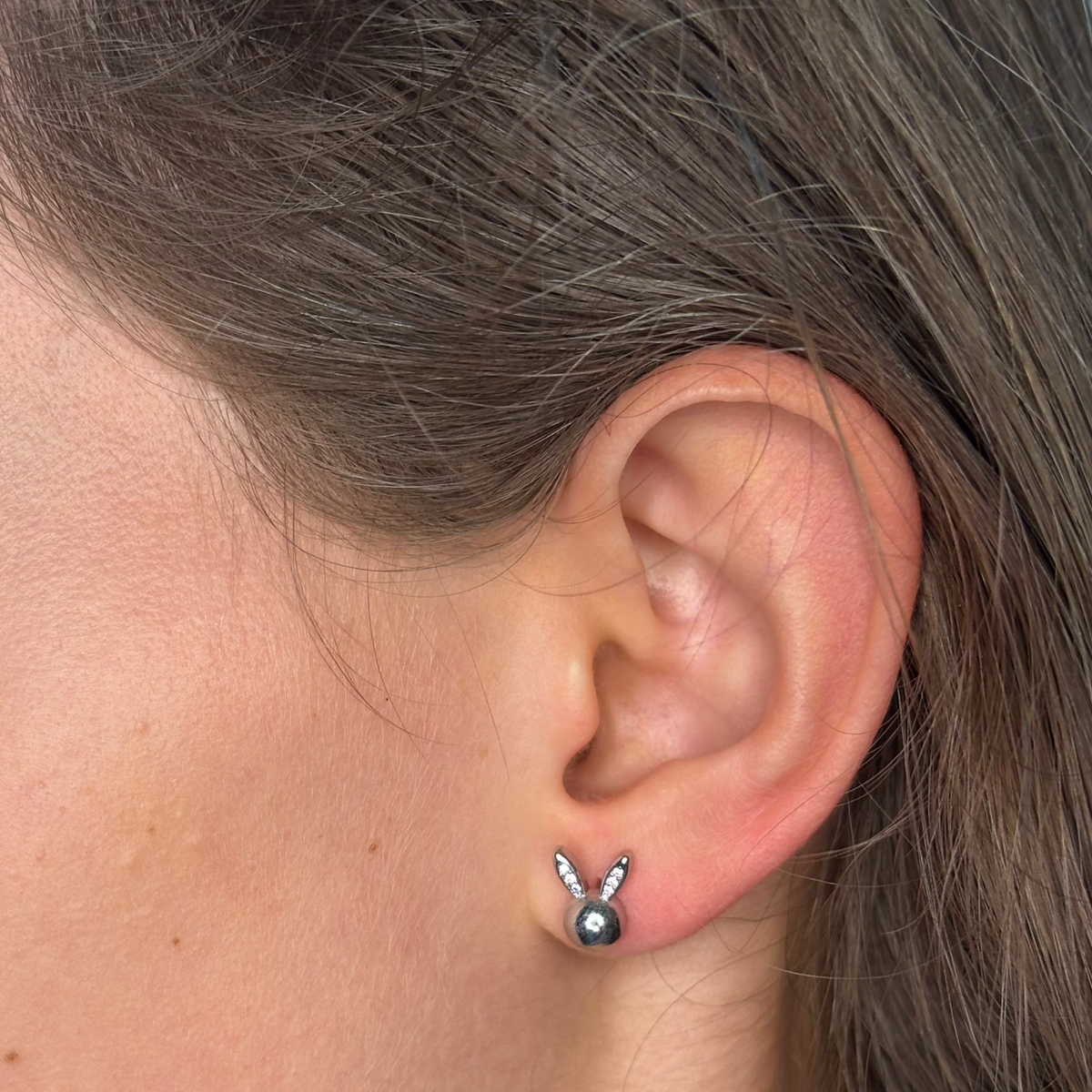Easter rabbit stud in girls ear