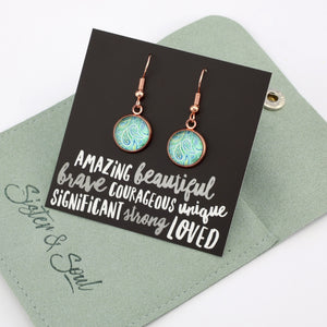 Teal paisley print rose gold dangle earrings on amazing inspiring word card on white background. With green coloured gift pouch. 