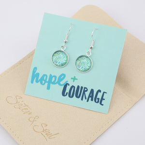 Teal print silver dangle earrings on hope and courage inspiring word card on white background.