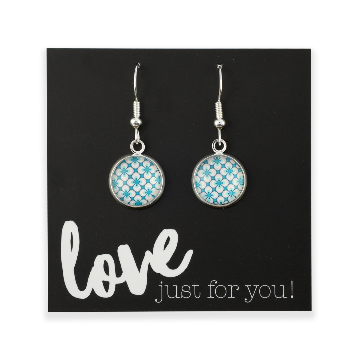 Teal print silver dangle earrings on love and inspiring word card on white background.