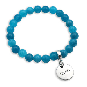 Blue beaded bracelet with a silver 'ENJOY' charm on a white background