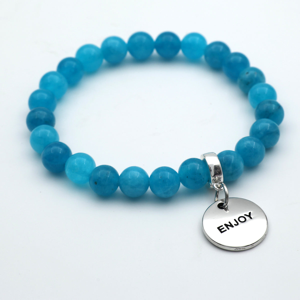Blue beaded bracelet with a silver 'ENJOY' charm on a white background
