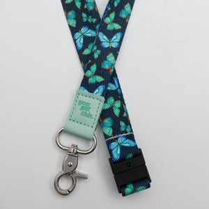 You Got This embossed on a navy lanyard with teal butterflies and mint trim and a lobster clasp.