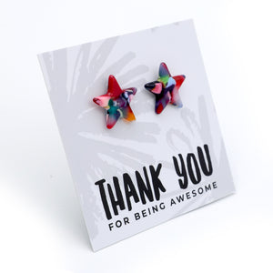 Two star-shaped stud earrings with a colorful marbled pattern in red, blue, green, and yellow, displayed on a white card that reads 'THANK YOU FOR BEING AWESOME' against a white background.