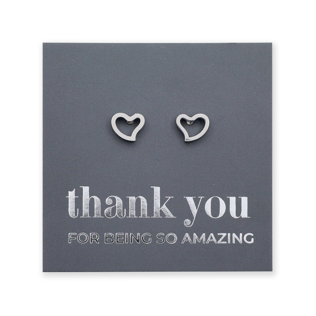 Four pairs of heart-shaped earrings on cards with 'thank you' messages.
