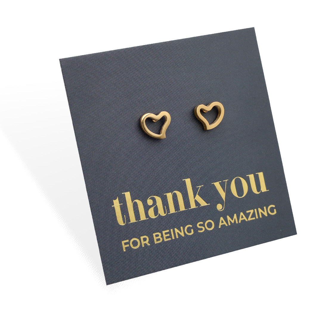 Gold heart-shaped earrings on a 'thank you for being so amazing' card