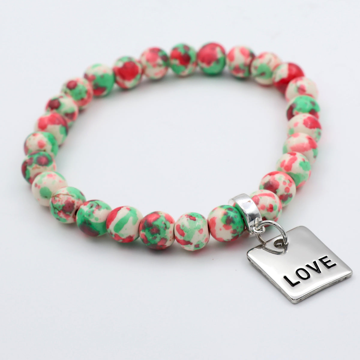 Beaded bracelet with a 'LOVE' charm on a white background