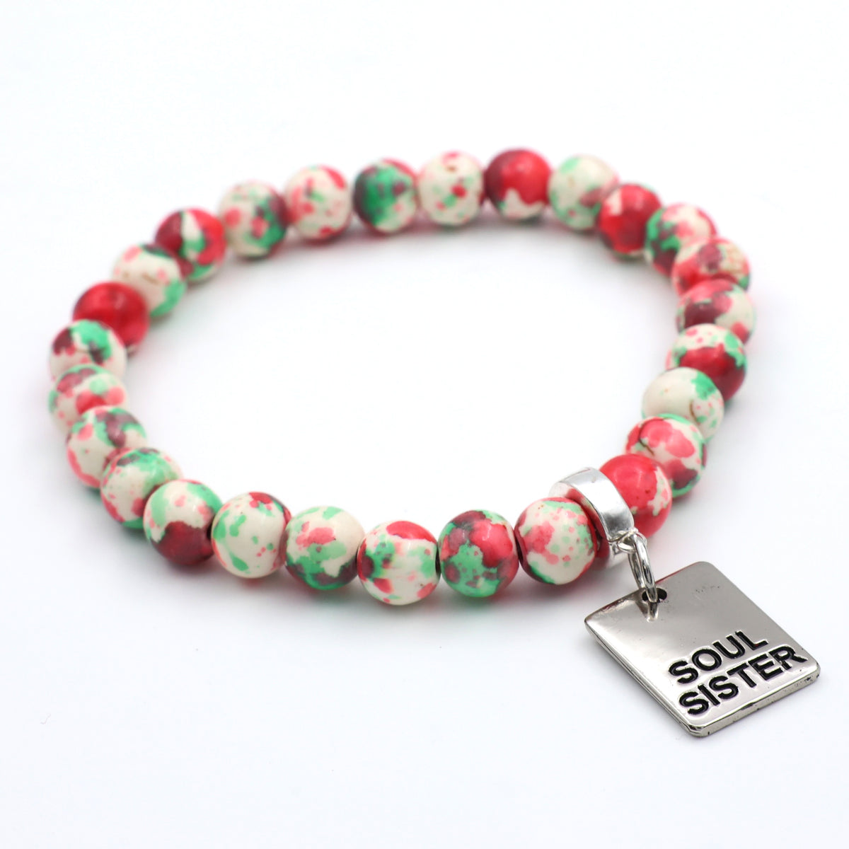 Multicolored beaded bracelet with a 'Soul Sister' charm on a white background