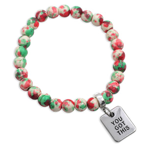 Bracelet with red and green marbled beads and 'YOU GOT THIS' charm on a white background