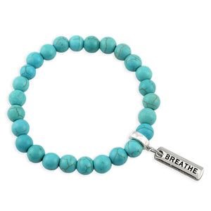 Turquoise beaded bracelet with a 'BREATHE' tag on a white background
