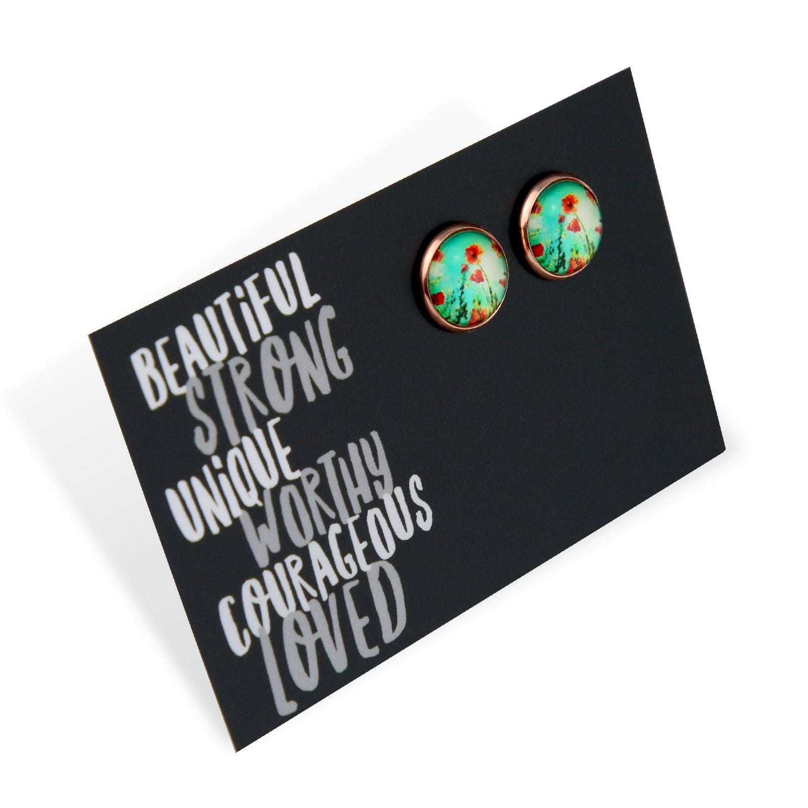 Pair of earrings on a card with motivational text