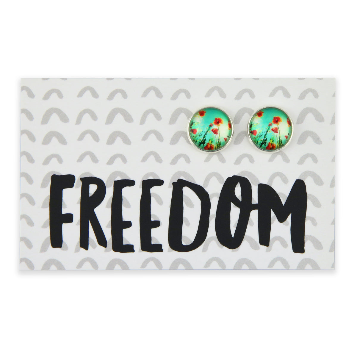 Pair of earrings with floral design on a card with 'FREEDOM' text