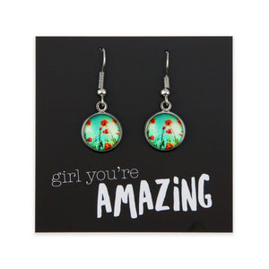 Pair of earrings with floral design on a card with 'girl you're amazing' text