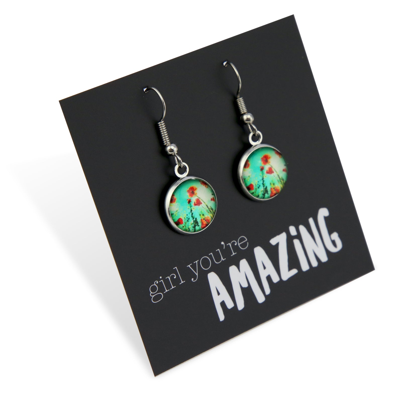 Pair of earrings with floral design on a card with 'girl you're amazing' text