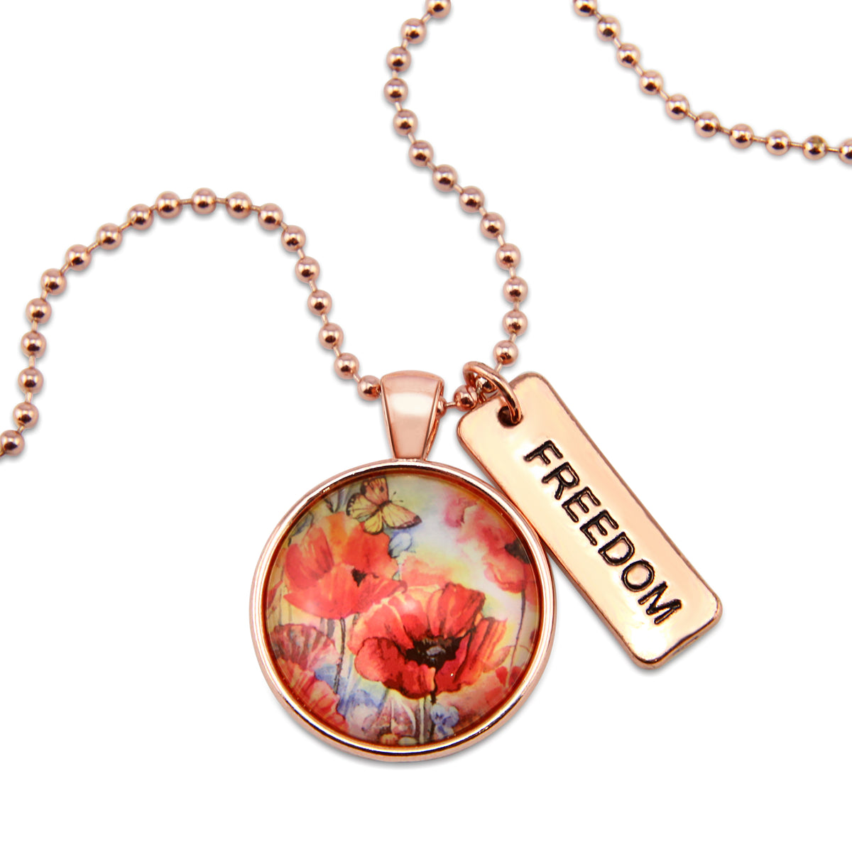Necklace with floral pendant and 'FREEDOM' tag on a white background